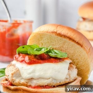 Ground chicken burger with marinara, mozzarella and basil
