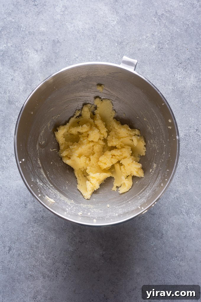 Creamed softened butter and granulated sugar, achieving a light and fluffy consistency.