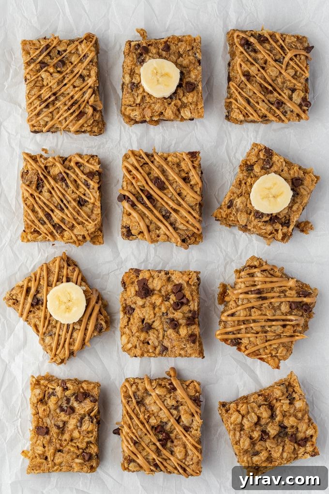 Banana peanut butter oatmeal bars topped with a drizzle of peanut butter and banana slices
