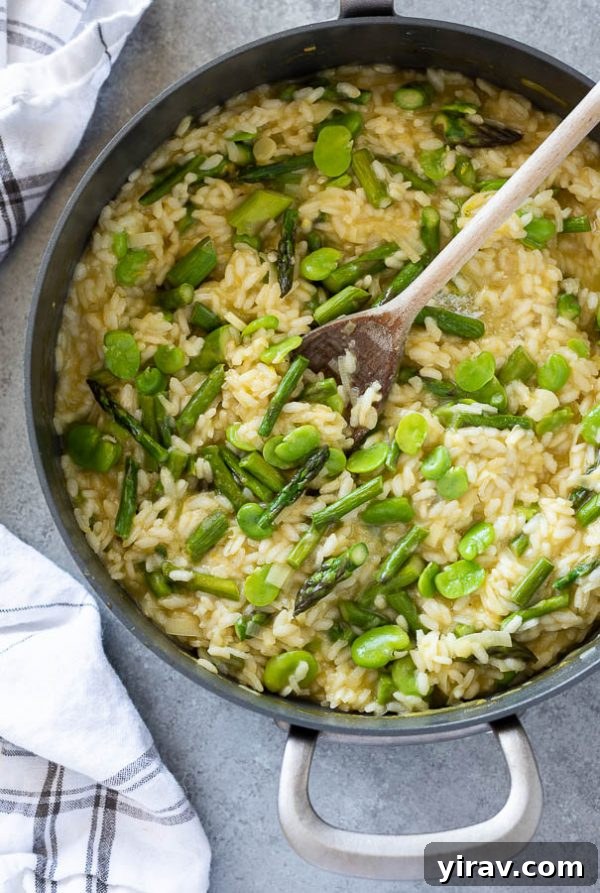 Vibrant Spring Risotto 3 Spring vegetable risotto simmering in a skillet, viewed from above, showcasing its creamy texture before serving.