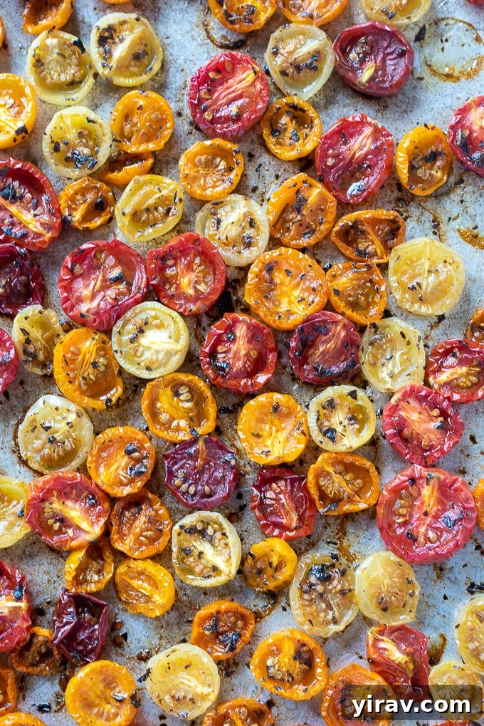 Roasted cherry tomatoes on a sheet pan