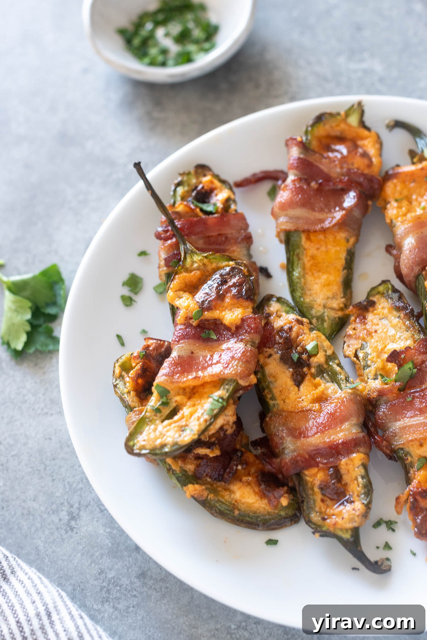 31 Tailgating Snacks That Steal the Show 30 Air fryer jalapeño poppers, perfectly wrapped in crispy bacon and ready to be devoured.