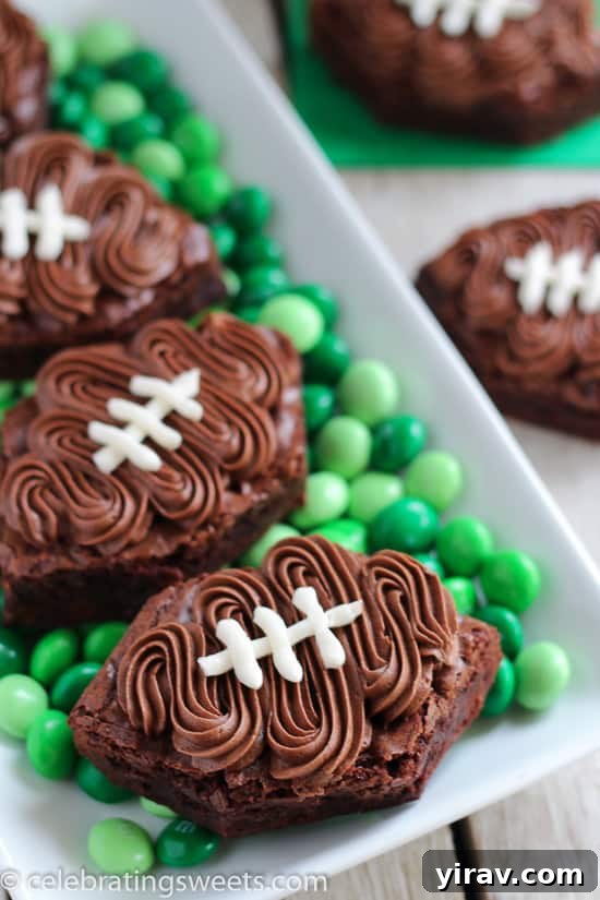31 Tailgating Snacks That Steal the Show 31 A platter of festive frosted football brownies, perfect for a game day dessert.