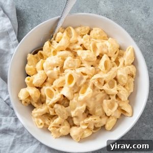 Stove top mac and cheese in a white bowl, close-up
