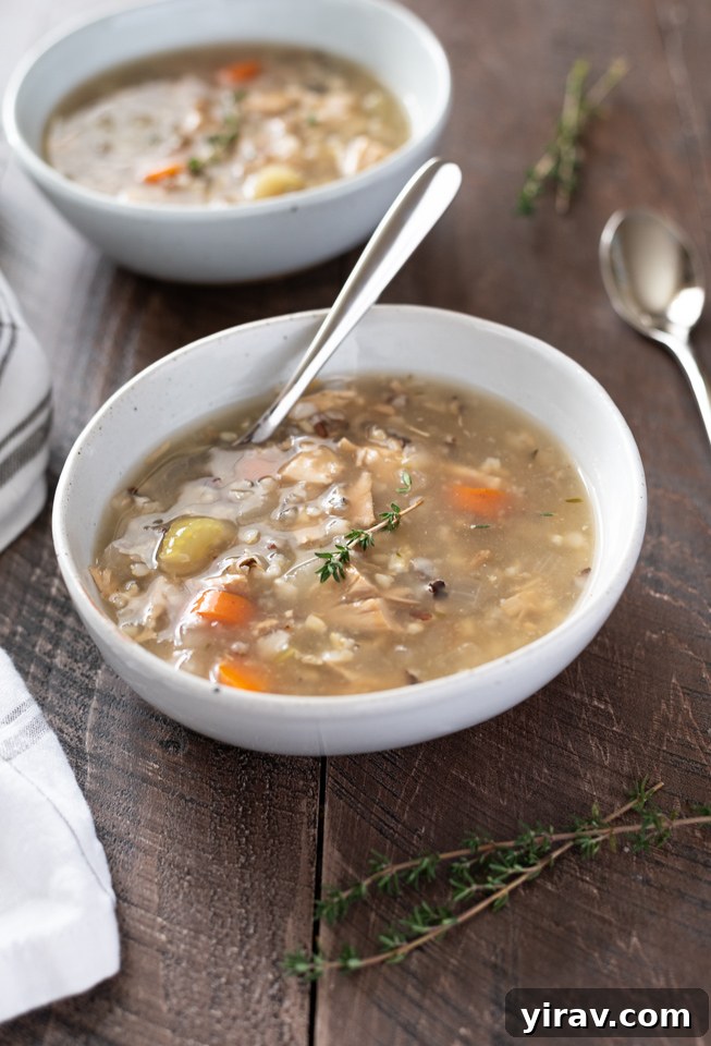 Close-up of a bowl of creamy Slow Cooker Turkey Wild Rice Soup, ready to be enjoyed.