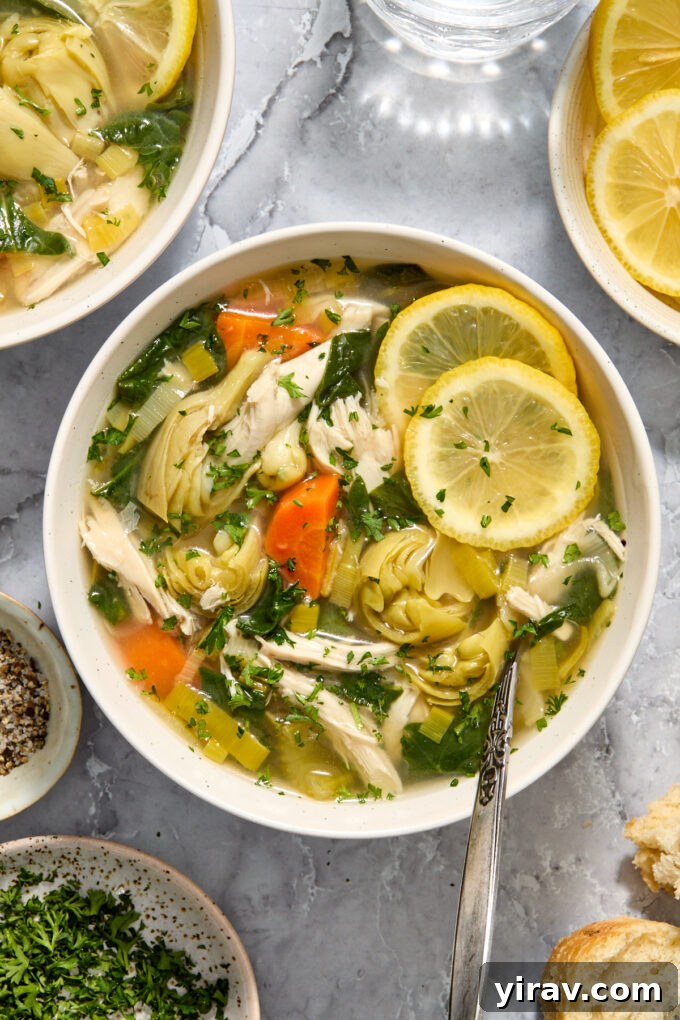 Slow cooker lemon chicken artichoke soup in a bowl.