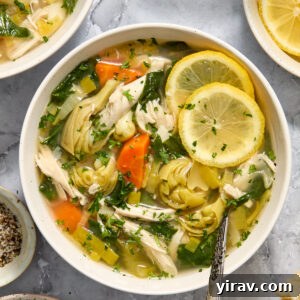 Slow cooker lemon chicken artichoke soup in a bowl.