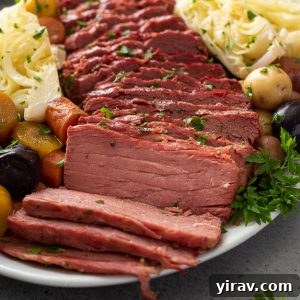 Corned beef and cabbage with veggies on a platter.