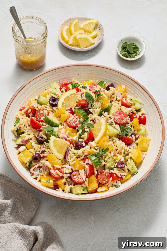 Greek orzo pasta salad in a serving bowl.