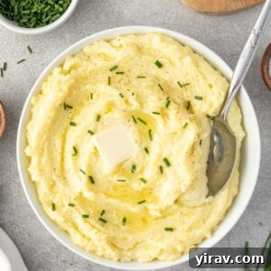 Sumptuous Yukon Gold Mashed Potatoes 8 Yukon gold mashed potatoes in a bowl with serving spoon