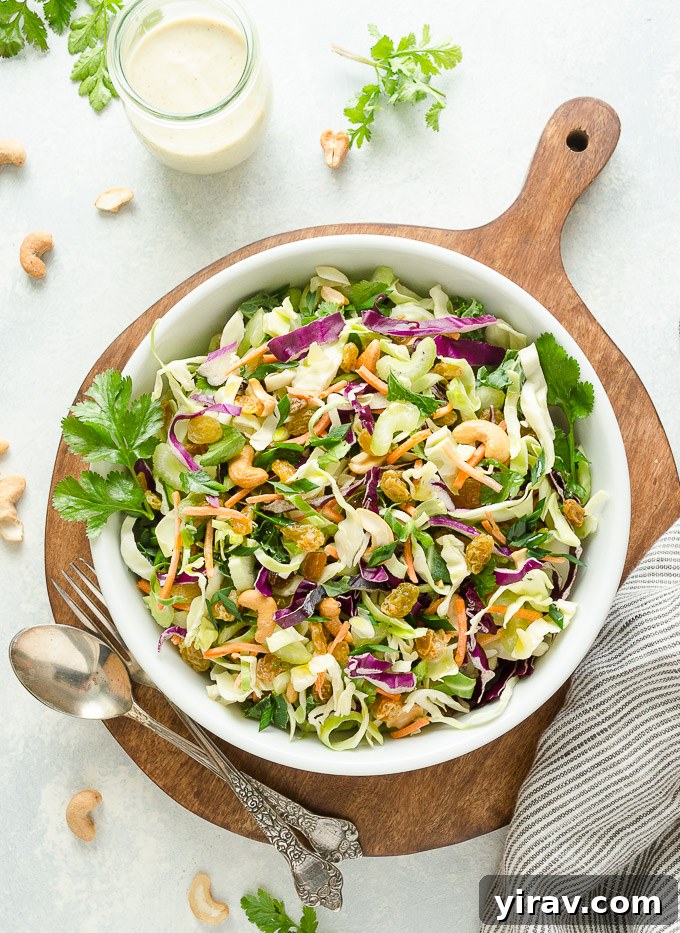 Golden Curry Coleslaw 3 Overhead view of curry coleslaw with cashews and golden raisins