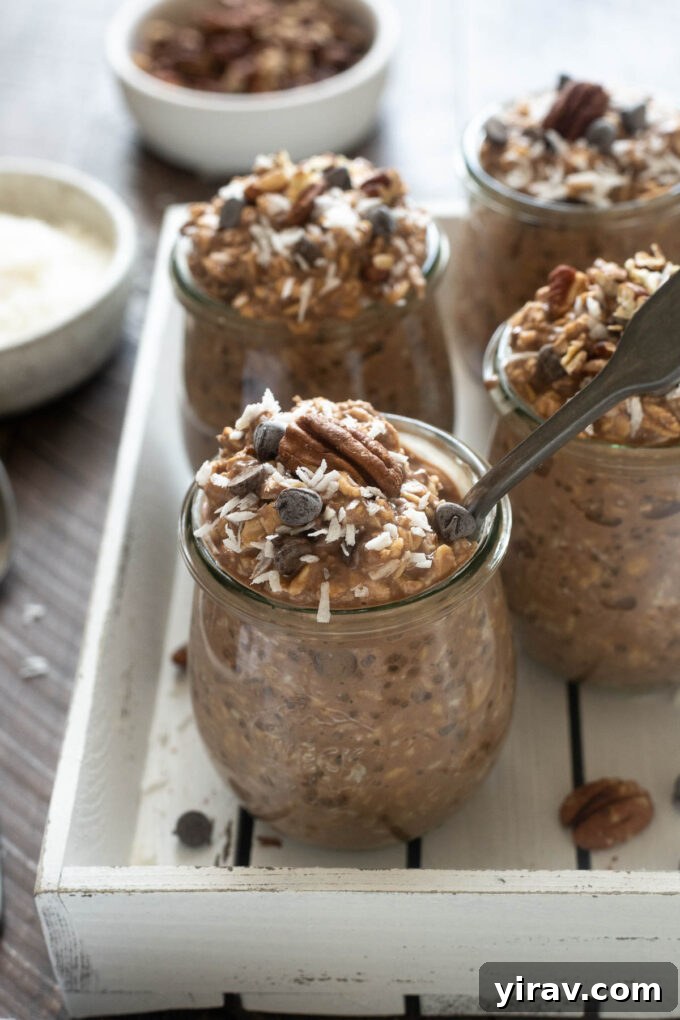 A close-up of German chocolate overnight oats in jars, ready to be enjoyed.