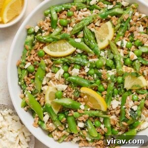 Spring farro salad in a white serving bowl