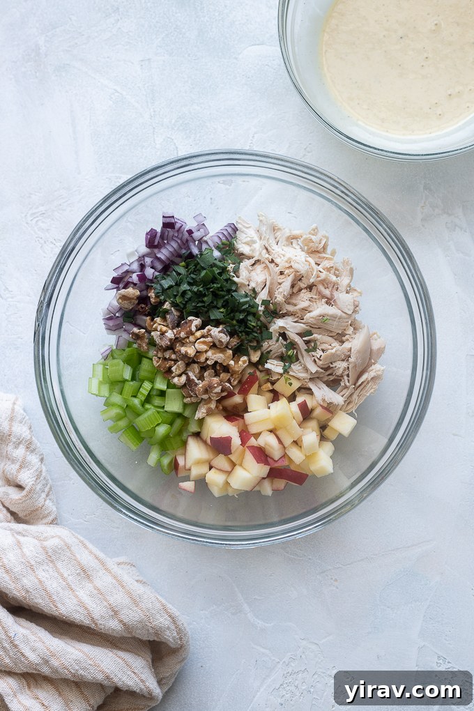 Chicken salad ingredients in a mixing bowl.