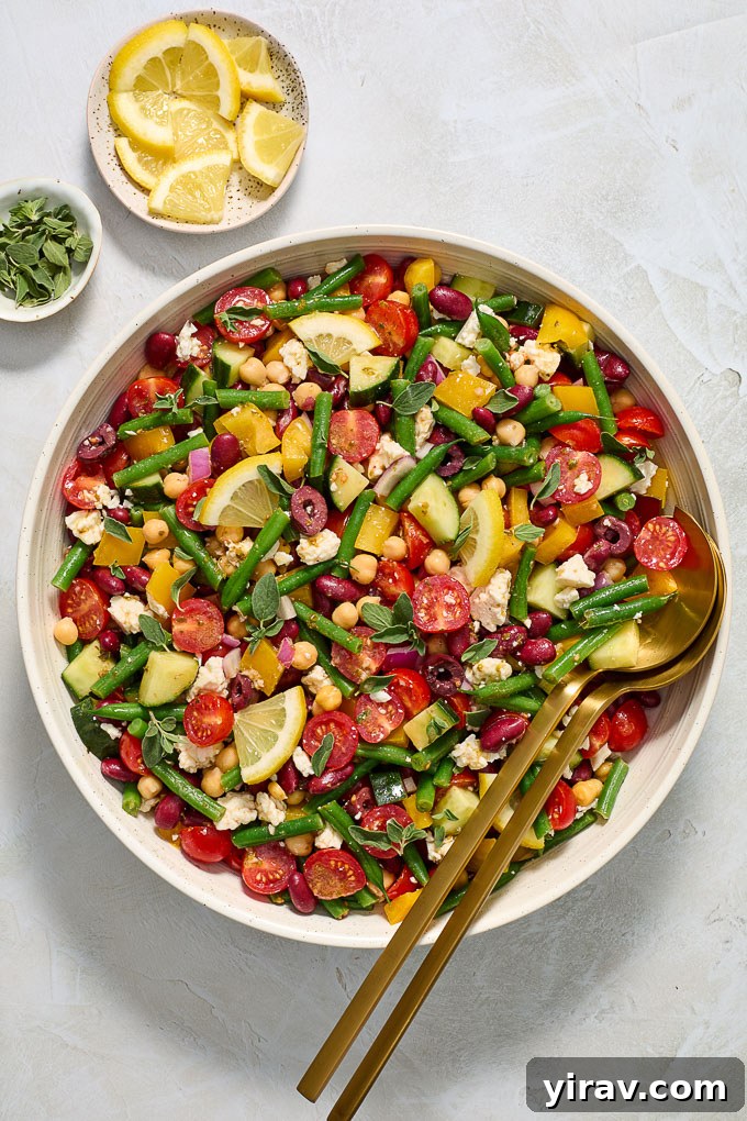 Zesty Mediterranean Bean Salad 3 Easy Mediterranean bean salad in a serving bowl, ready to be enjoyed.