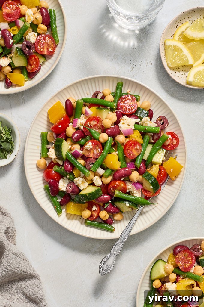 Zesty Mediterranean Bean Salad 6 Two plates of Mediterranean bean salad with feta, ready to eat.