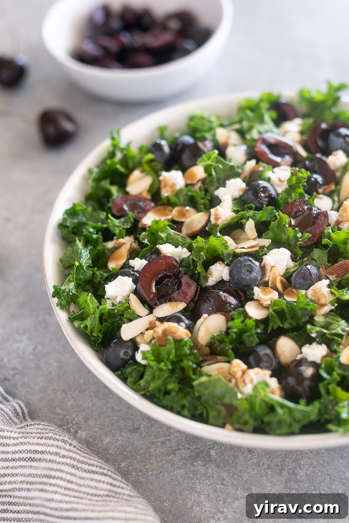 Close-up of Kale Cherry Salad in a simple white bowl, showcasing ingredients