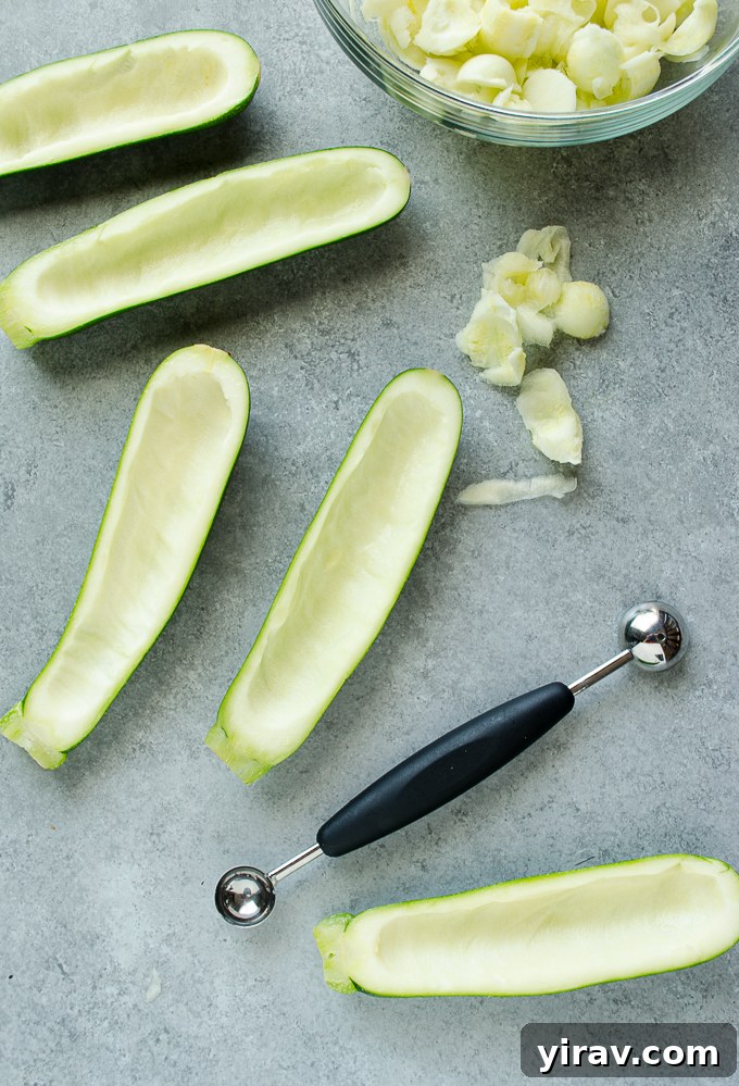 Hollowed out zucchini for zucchini boats, showing the quarter-inch border.
