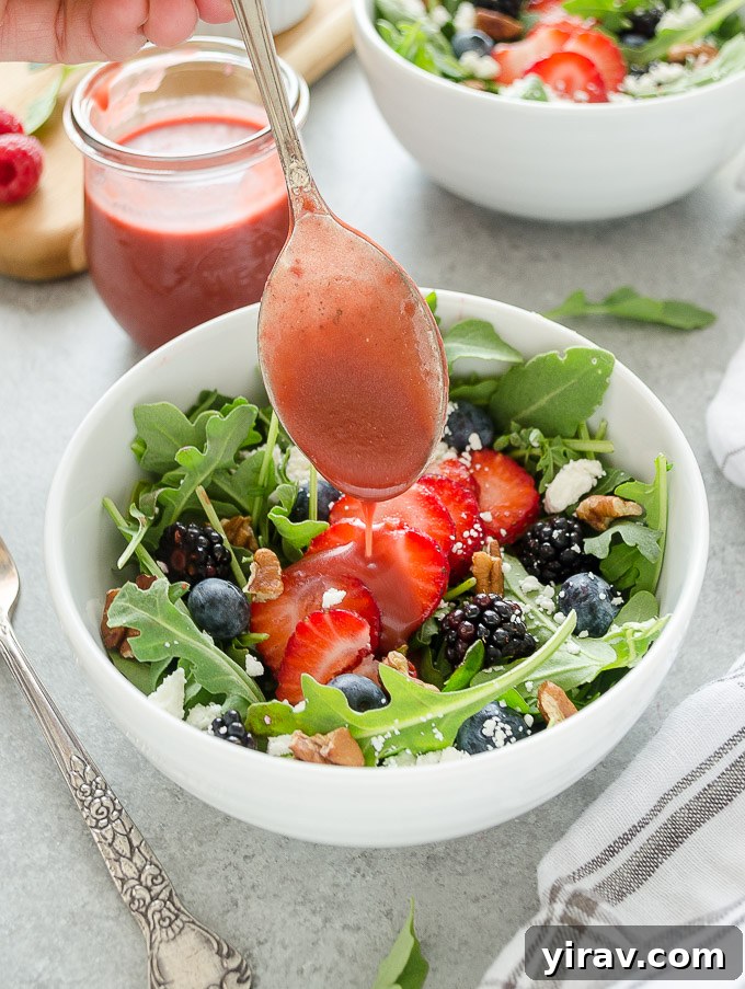 Vibrant Raspberry Vinaigrette 6 Fresh raspberry balsamic vinaigrette drizzling over a vibrant summer salad, ready to be enjoyed.