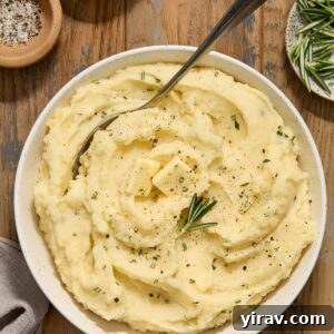 Crock pot mashed potatoes with buttermilk in a bowl.