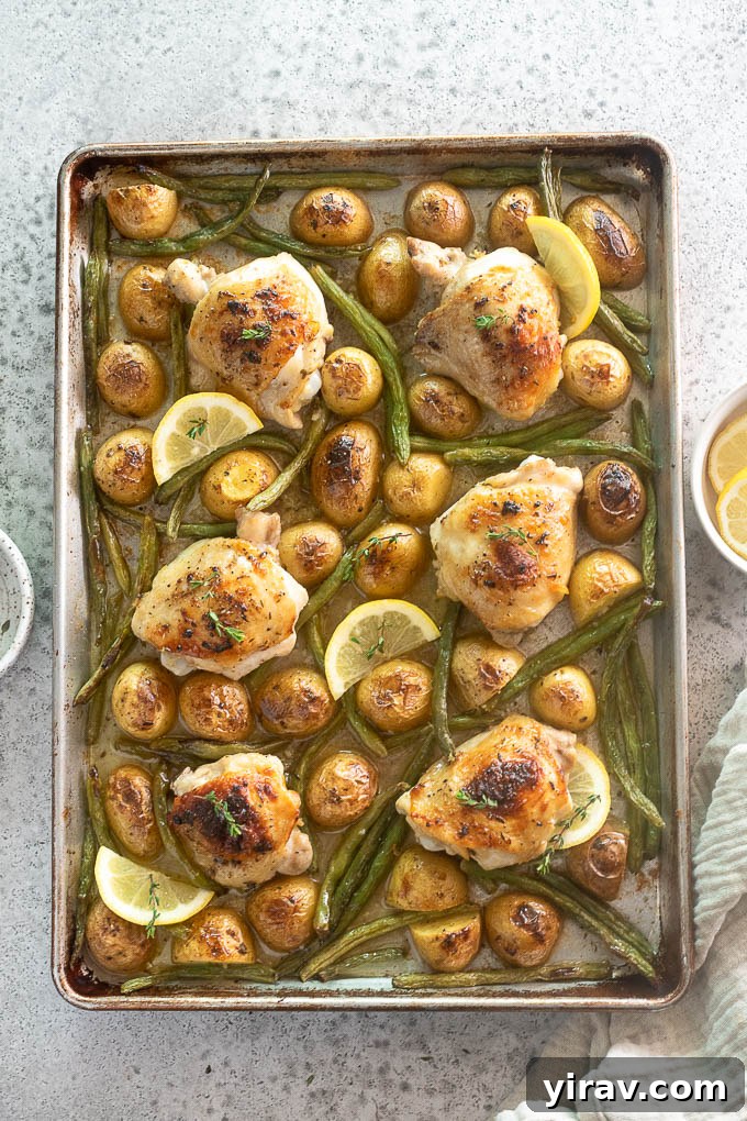 Sheet pan chicken thighs and potatoes with green beans.