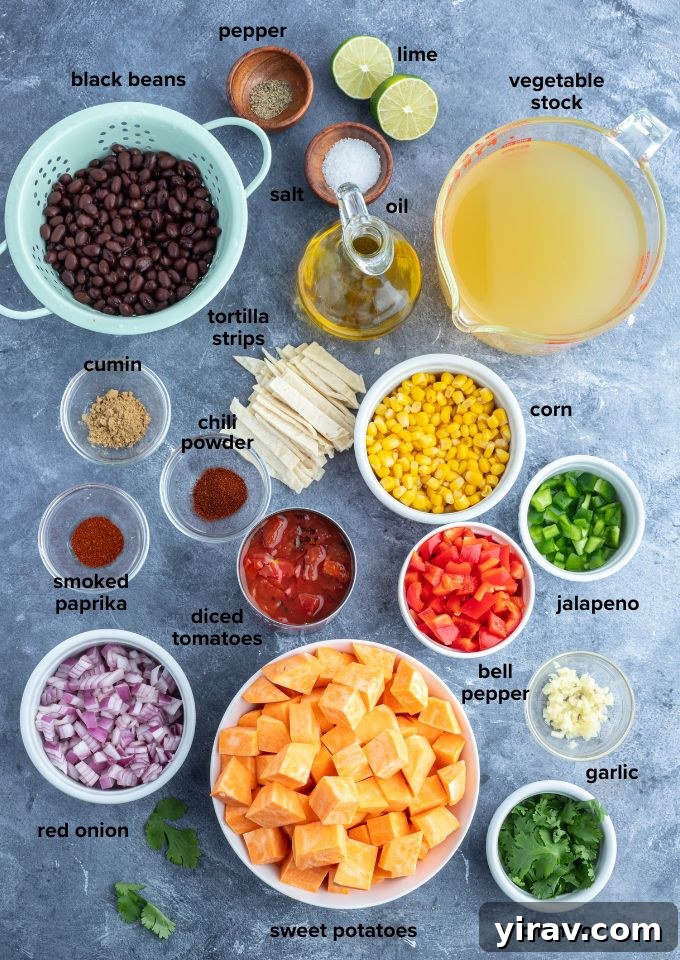 Plant-Powered Tortilla Soup 4 A flat lay of fresh ingredients for Vegetarian Tortilla Soup, including sweet potatoes, black beans, bell peppers, corn, spices, and cilantro, ready for preparation.