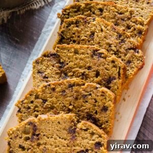 Spiced Pumpkin Chocolate Chip Bread 8 Chocolate Chip Pumpkin Bread sliced on a cutting board.