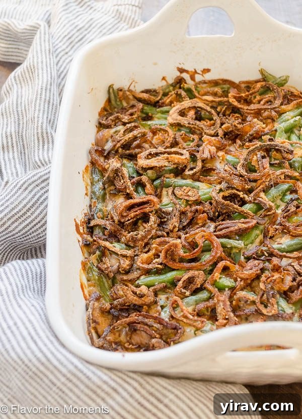 Homemade green bean casserole in baking dish with crispy shallots on top, ready to serve for Thanksgiving