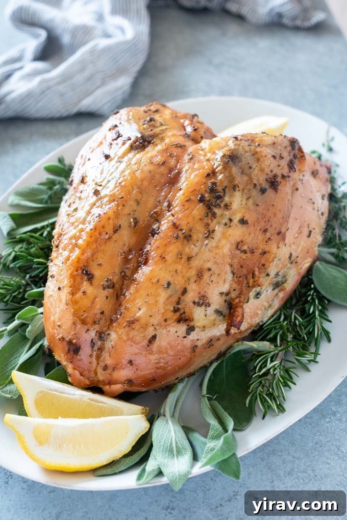 Herb and garlic roasted turkey breast on a serving platter