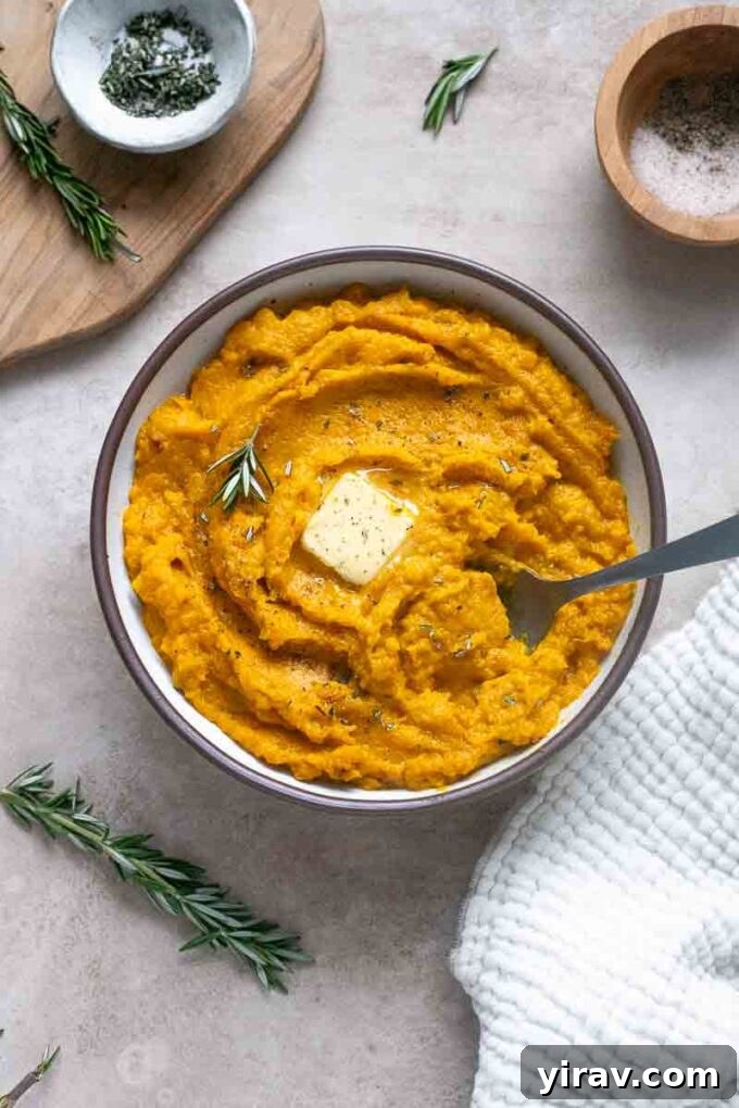 Velvet Kabocha Puree 11 Mashed kabocha squash in a bowl with a swirl of melted butter on top.