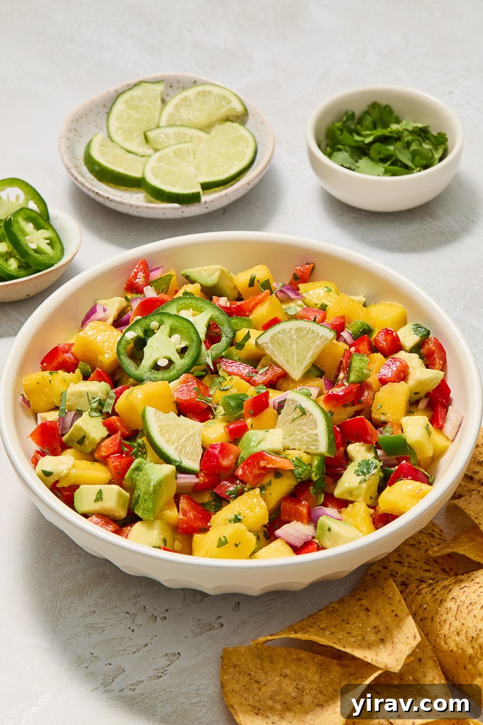 A vibrant bowl of freshly made Avocado Mango Salsa, showcasing its rich colors and inviting texture.