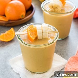Citrus Cream Dream 6 Orange cream smoothie in a jar with orange and banana skewered on a toothpick
