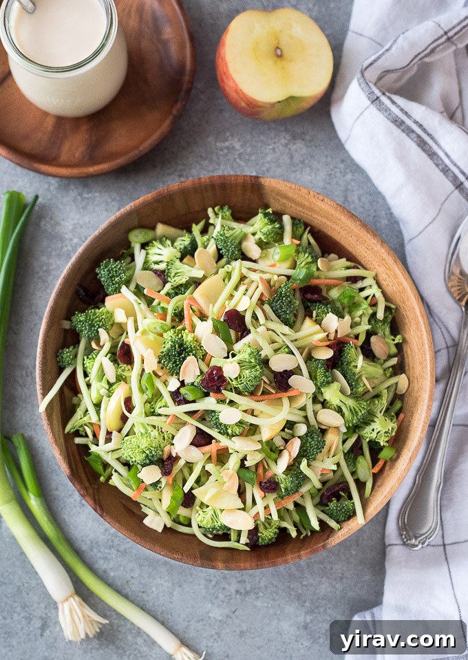 Crisp Broccoli Delight 3 Broccoli slaw recipe ingredients in a bowl before being tossed with dressing.