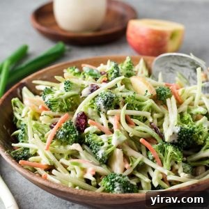 Crisp Broccoli Delight 8 Broccoli slaw in a bowl with jar of dressing behind