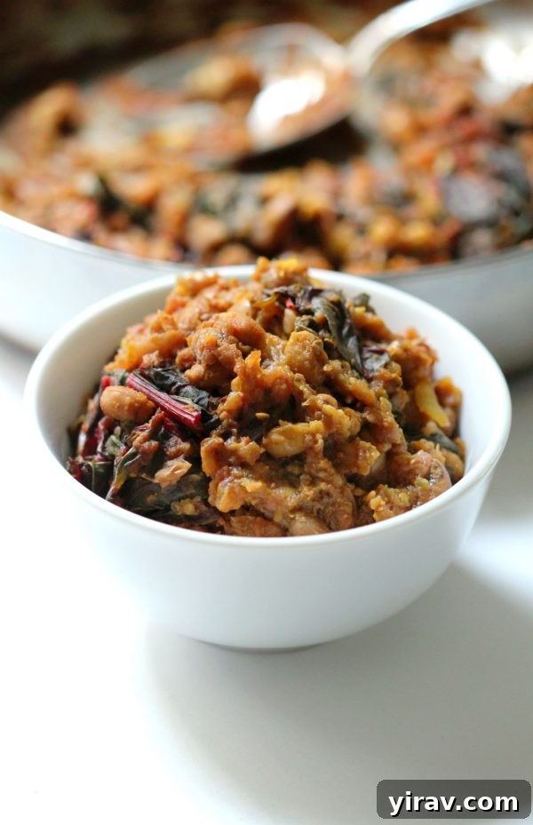 A warming bowl of black eyed pea curry with Swiss chard, promising a comforting and flavorful vegan meal.