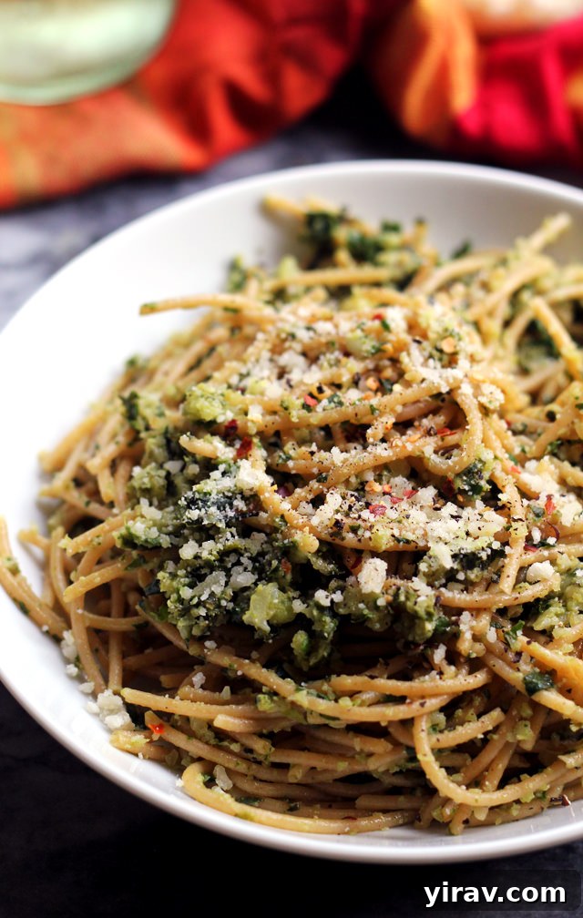 A hearty plate of spaghetti with cauliflower and garlicky Swiss chard gremolata, offering a delicious and healthy pasta dish.