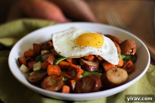 Sweet potato and leek hash in a bowl with egg on top