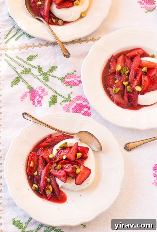 23 Rhubarb Recipes Essential Produce Guide 13 Three elegant dishes of Roasted Rhubarb Crazy Berry Meringues on a floral tablecloth, featuring crisp meringue and berry compote.