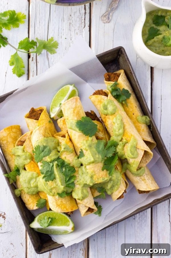 Baked black bean sweet potato taquitos on parchement