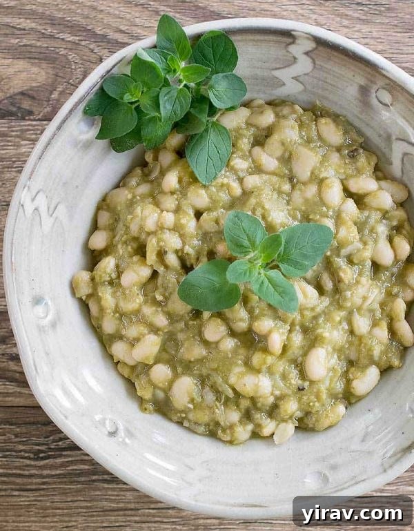 Tomatillo white beans in a white bowl