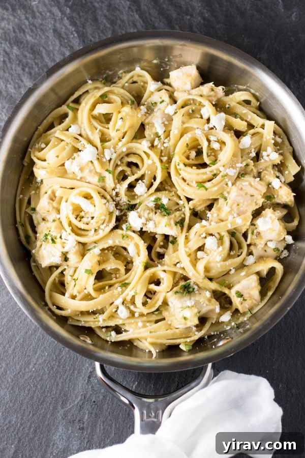 Overhead view of tomatillo chicken pasta in skillet