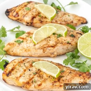 Grilled tequila lime chicken on a white platter
