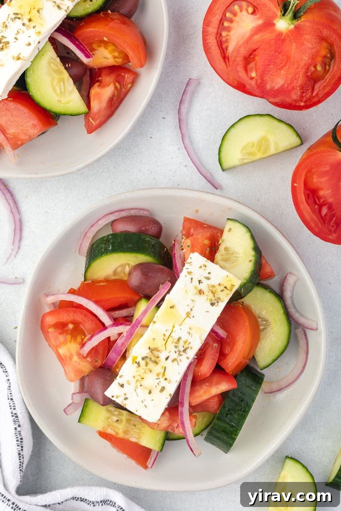 Greek village salad on a white plate, ready to eat