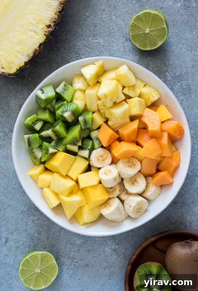 Tropical fruits in serving bowl before stirring, ready for dressing.