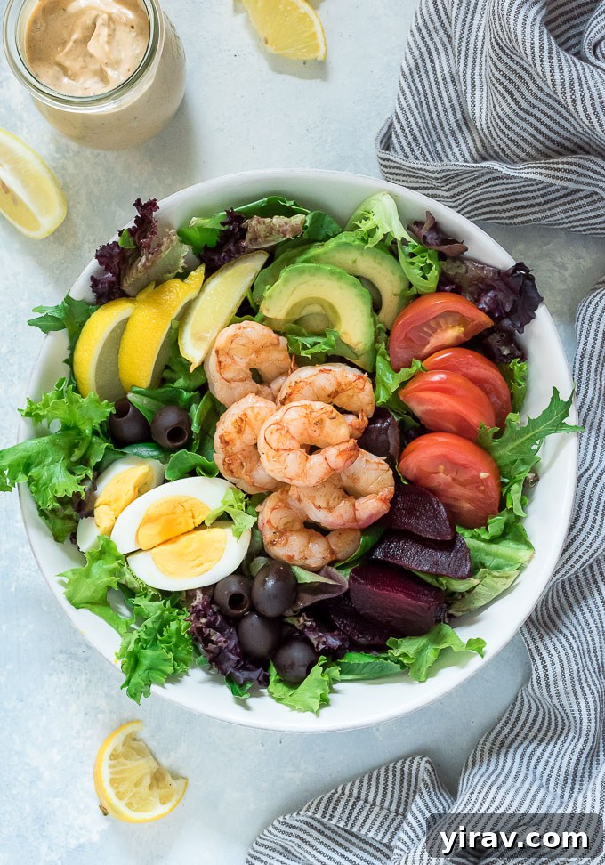 Undressed Shrimp Louie salad in a white bowl, showcasing fresh ingredients before dressing is added.