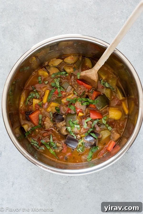 Effortless Instant Pot Ratatouille 4 An inviting overhead shot of ratatouille simmering inside an Instant Pot, showing its rich colors and textures.