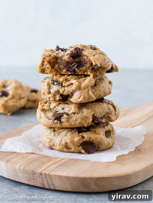 Stack of freshly baked flourless peanut butter cookies with chocolate chips and sea salt
