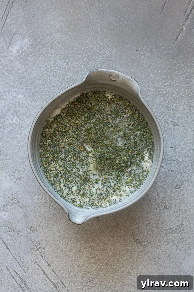 Ingredients for ranch dressing using Greek yogurt in a bowl.