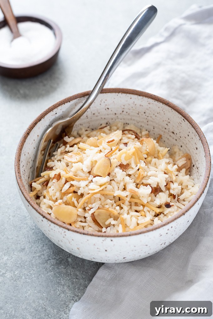 Fork nestled into a bowl of rice pilaf