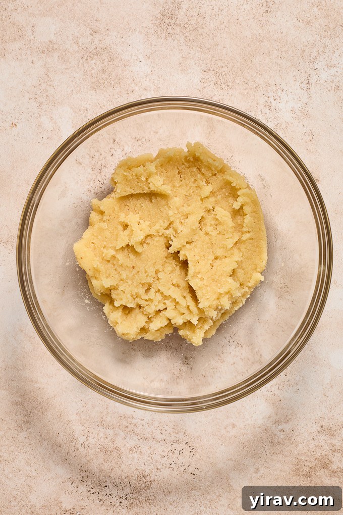 Almond horn cookie batter in mixing bowl.